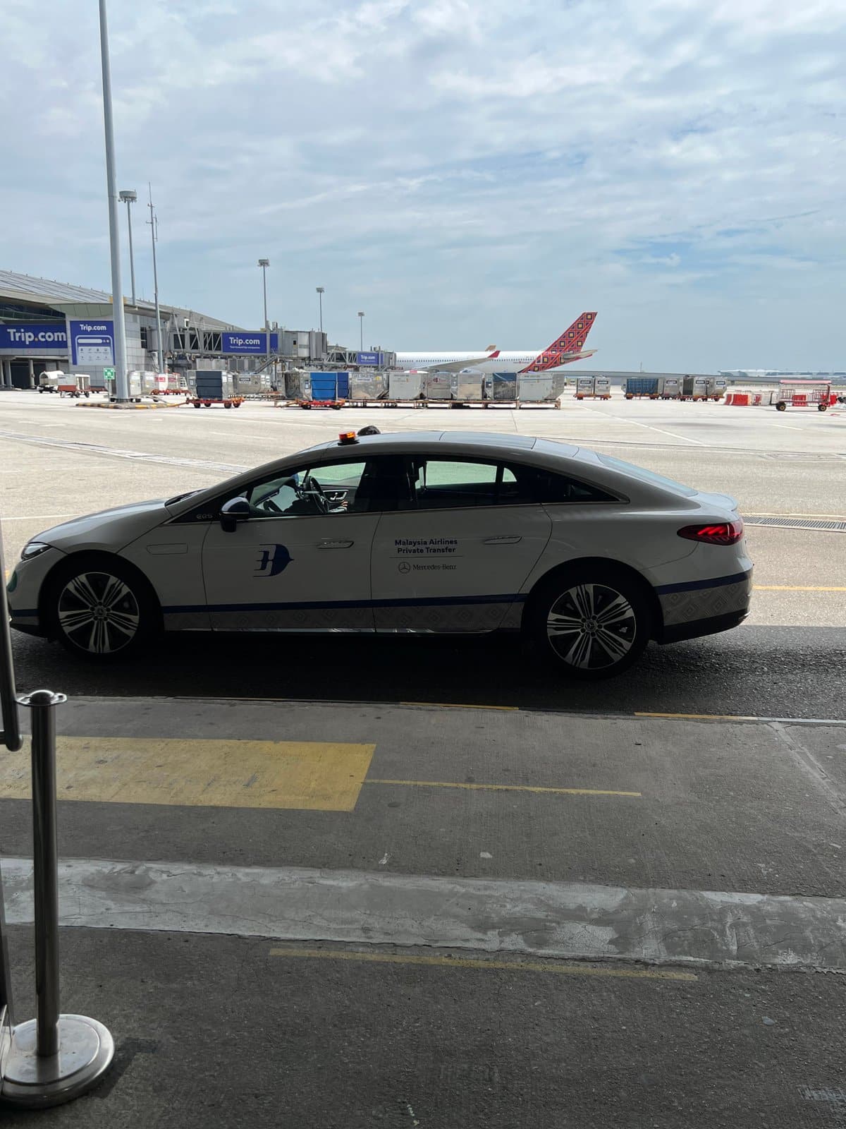The private transfer car driving across the tarmac