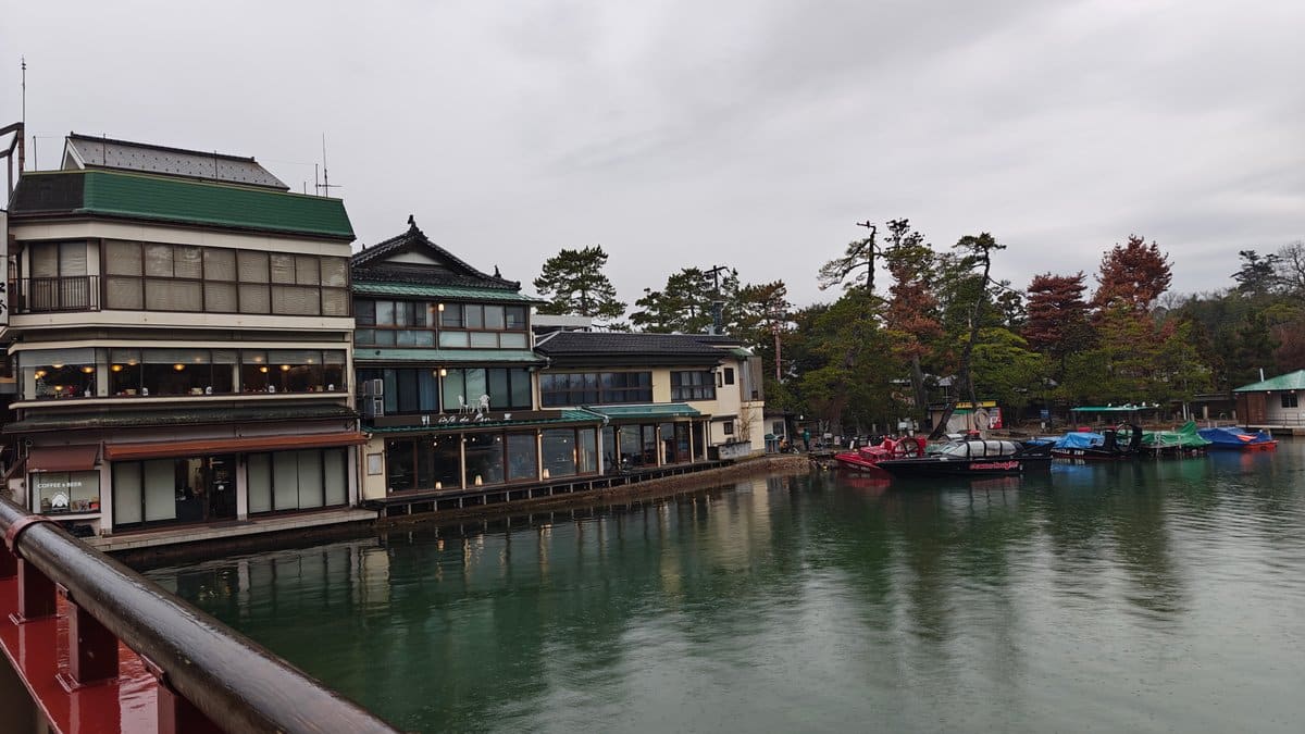 Traditional canal-side inns and moored boats at Monju