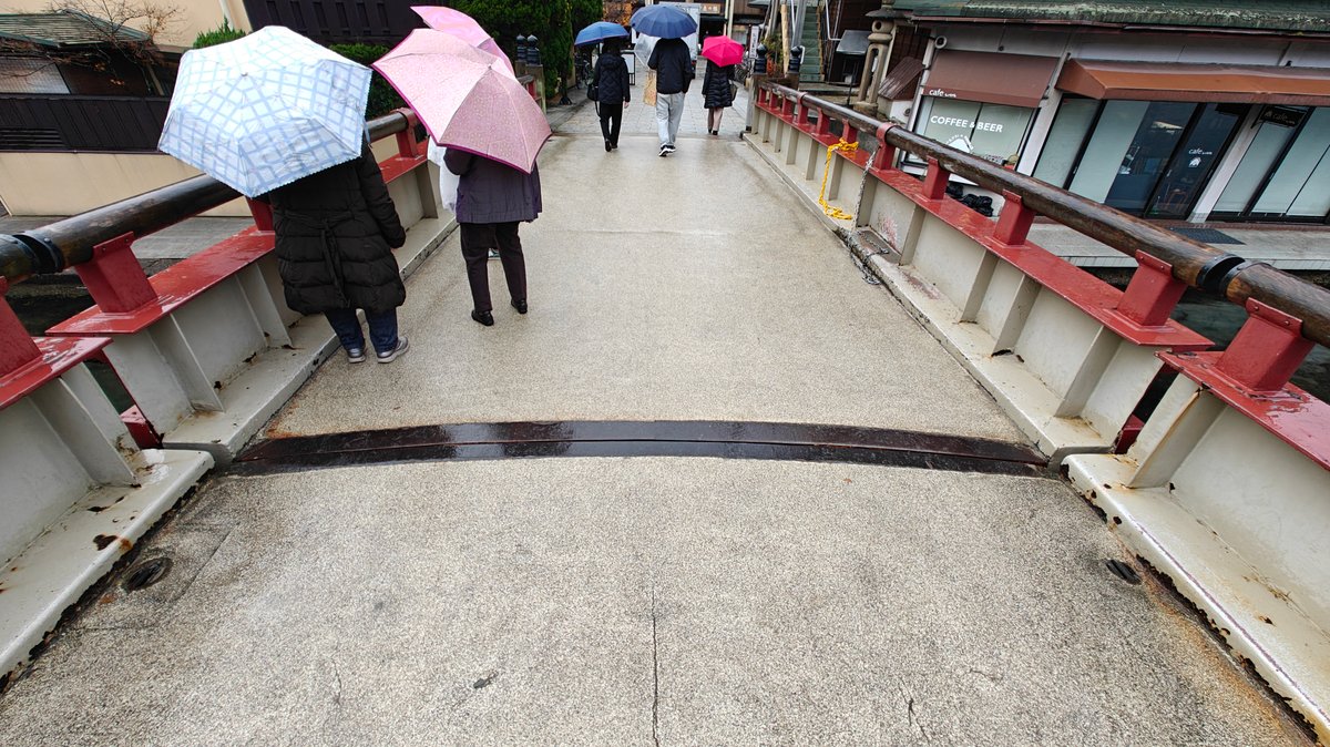 Visitors crossing rotating bridge deck