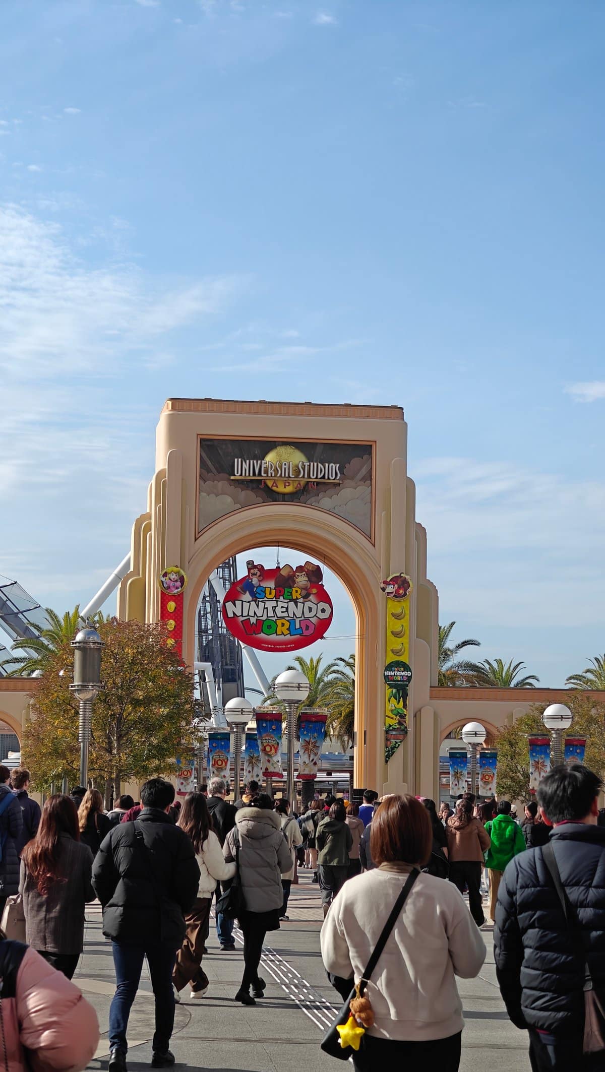 Walking through CityWalk commercial area toward park entrance