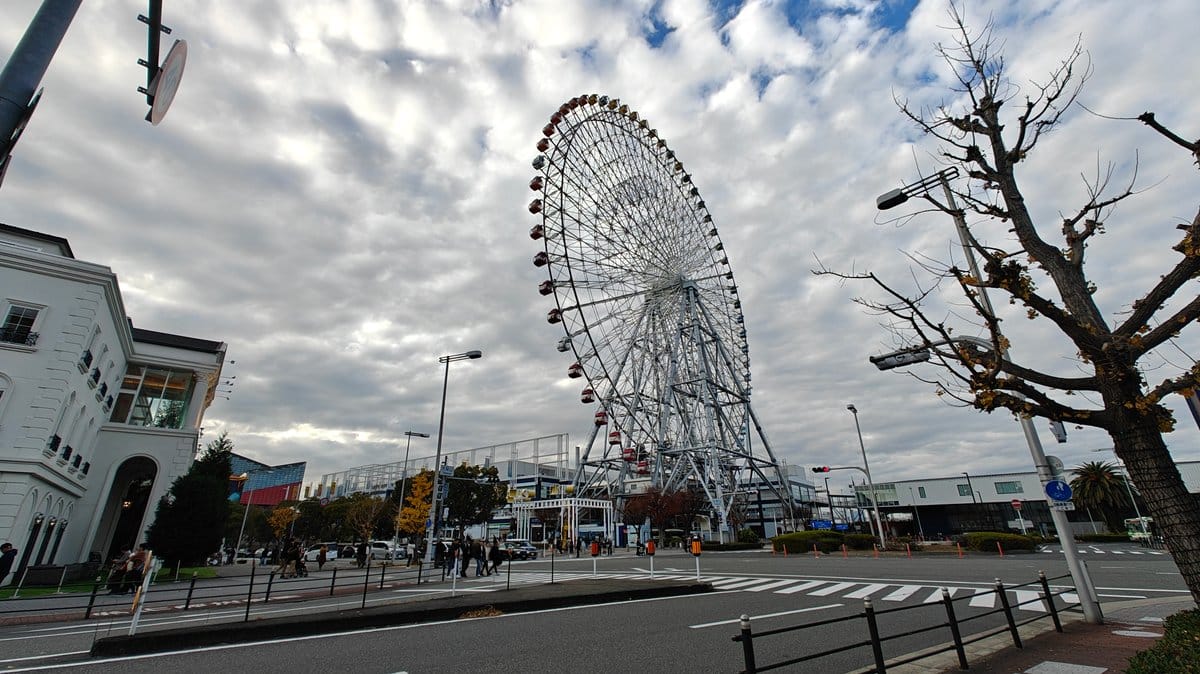 Waterfront area with Ferris wheel and amusement park
