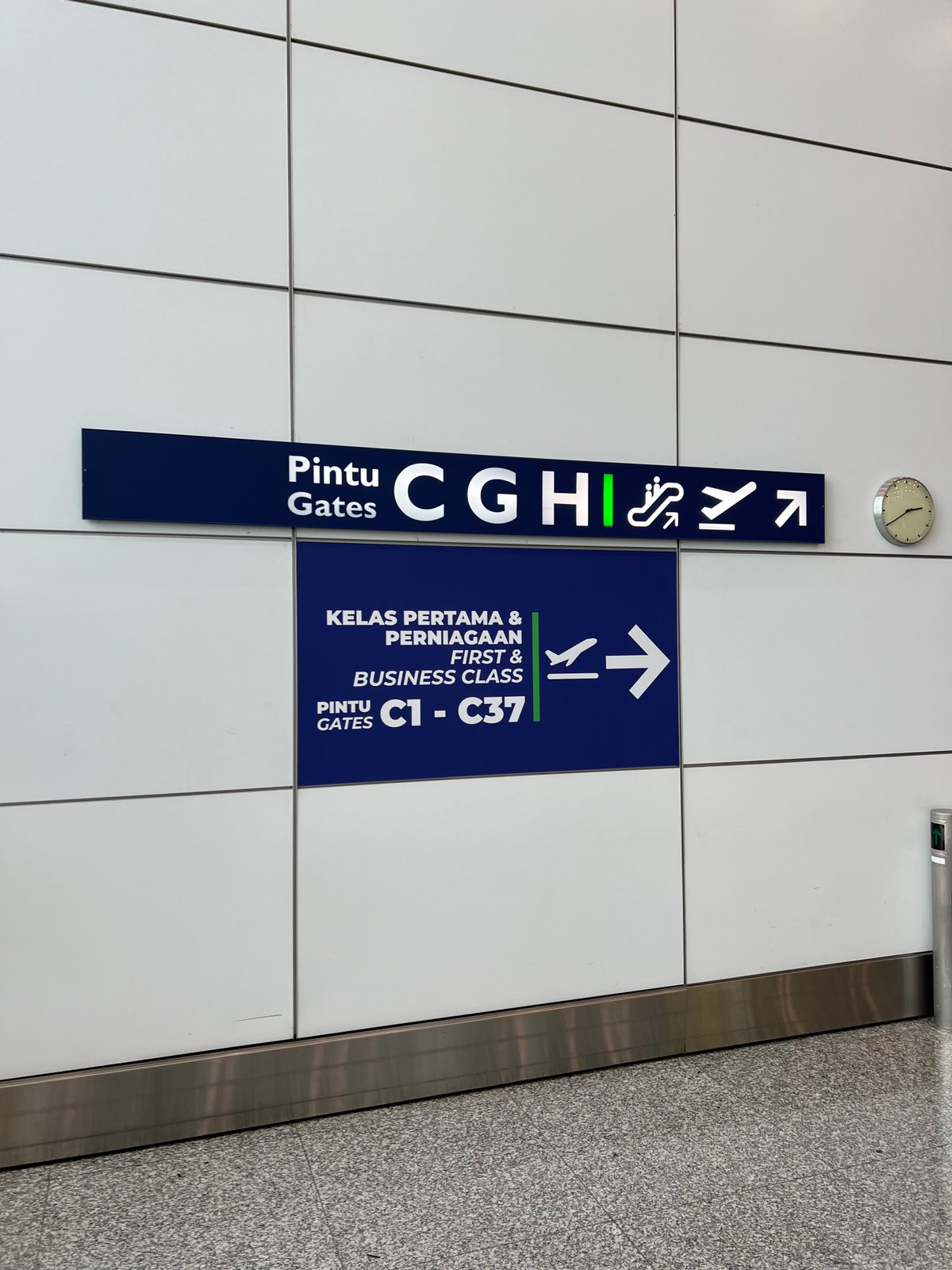 Wayfinding sign in the main terminal reading 'Pintu