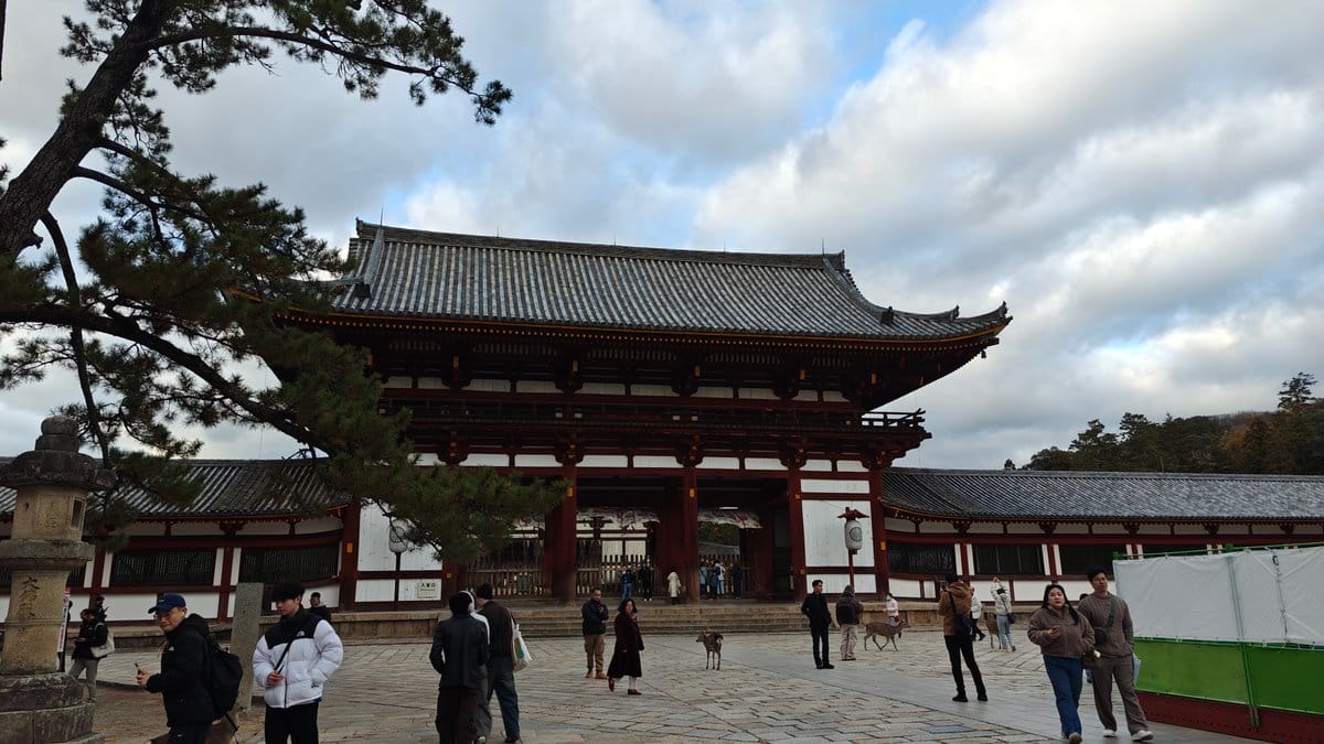 Wide view of Chumon gate with visitors and