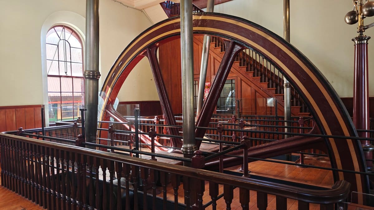 1877 beam engine flywheel and beam