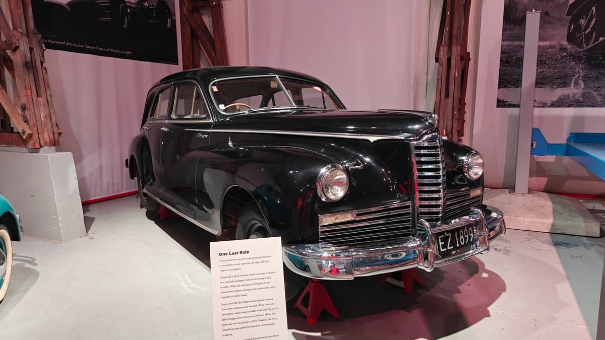 A black hearse with the registration EZ1699.