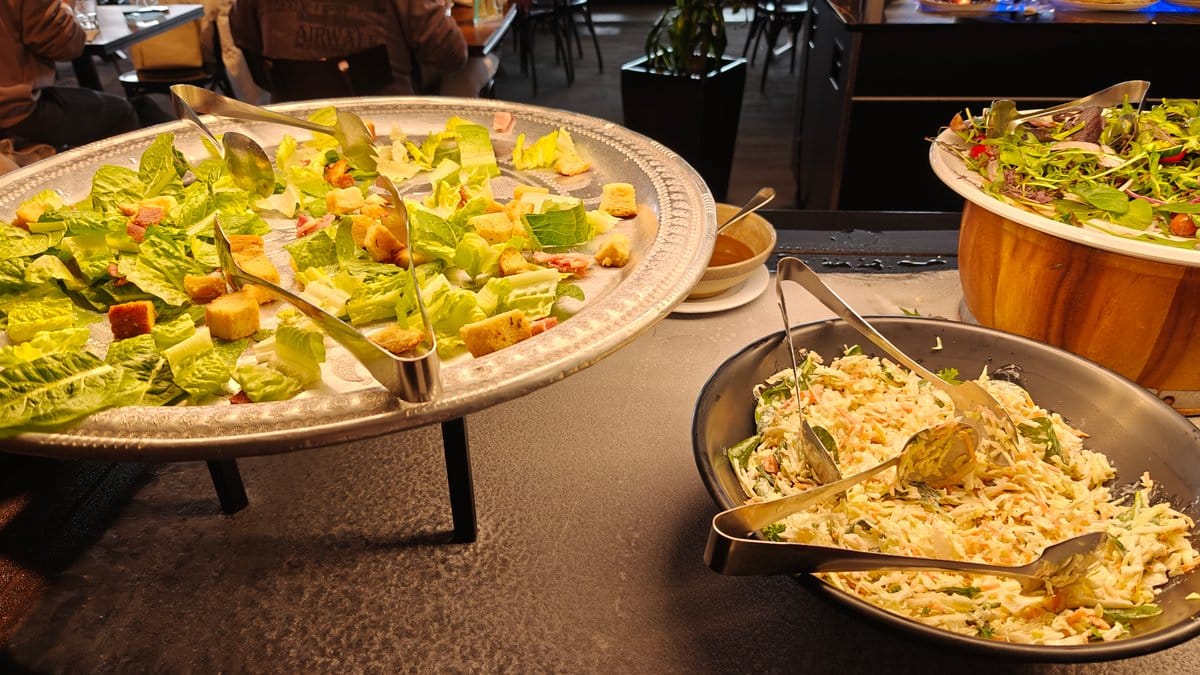 A bowl of green salad on the cold