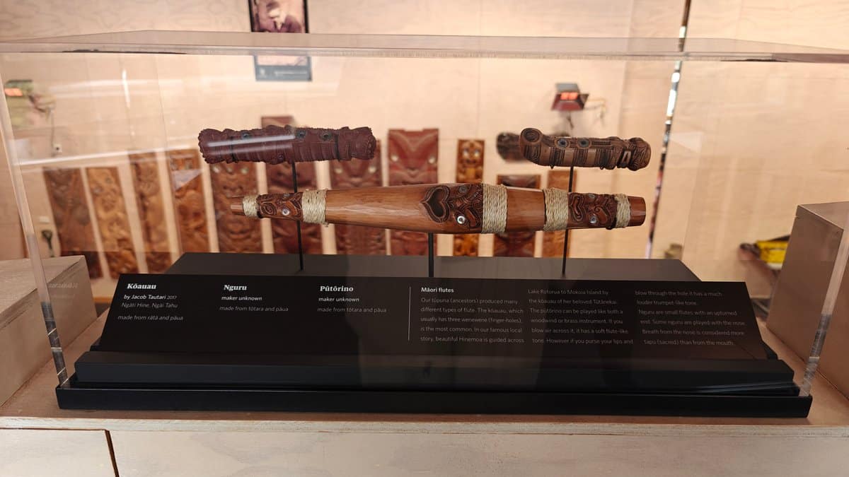 A case of carved wooden pieces with their