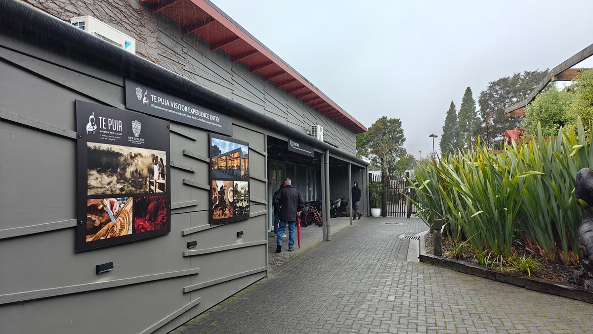 A covered walkway with interpretive panels ranged along
