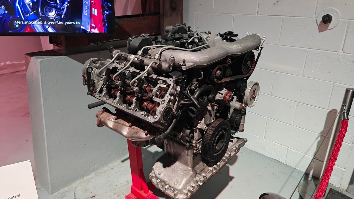 A diesel engine on its stand with a
