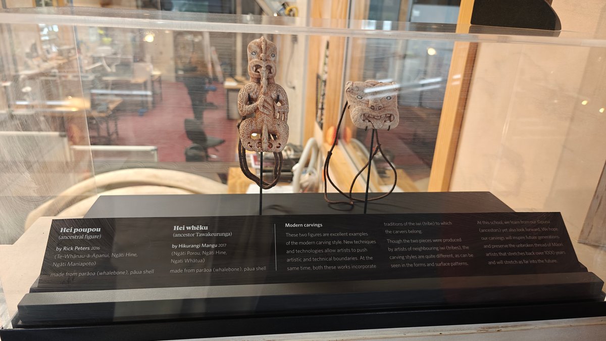 A display case of carved bone and stone