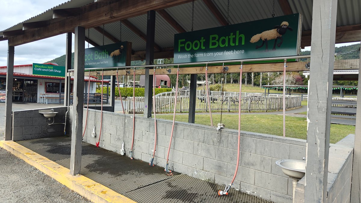 A foot bath station under its sign at