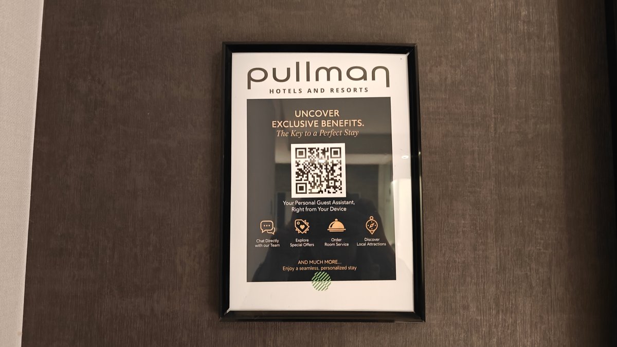 A framed card reading pullman HOTELS AND RESORTS,