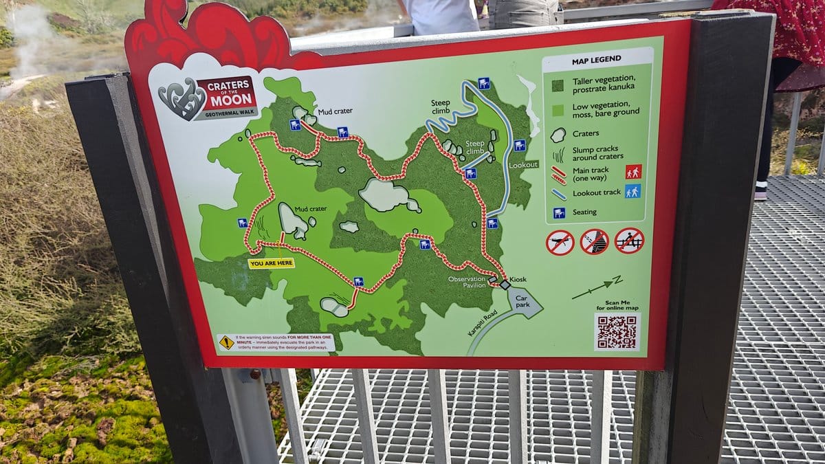 A framed track map mounted beside the boardwalk.