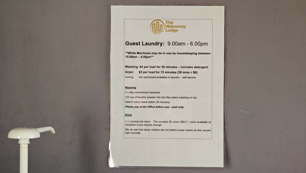 A guest laundry notice giving the hours as