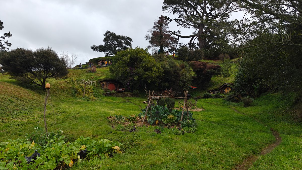 A hobbit hole on the hillside with the