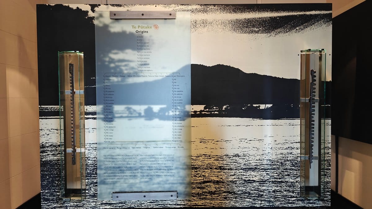 A large photographic mural of a coastal landscape
