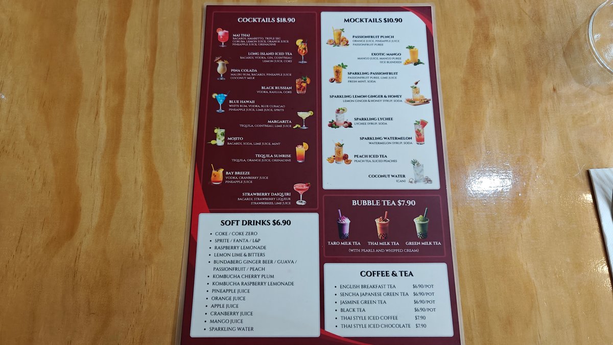 A menu stand on the table listing the
