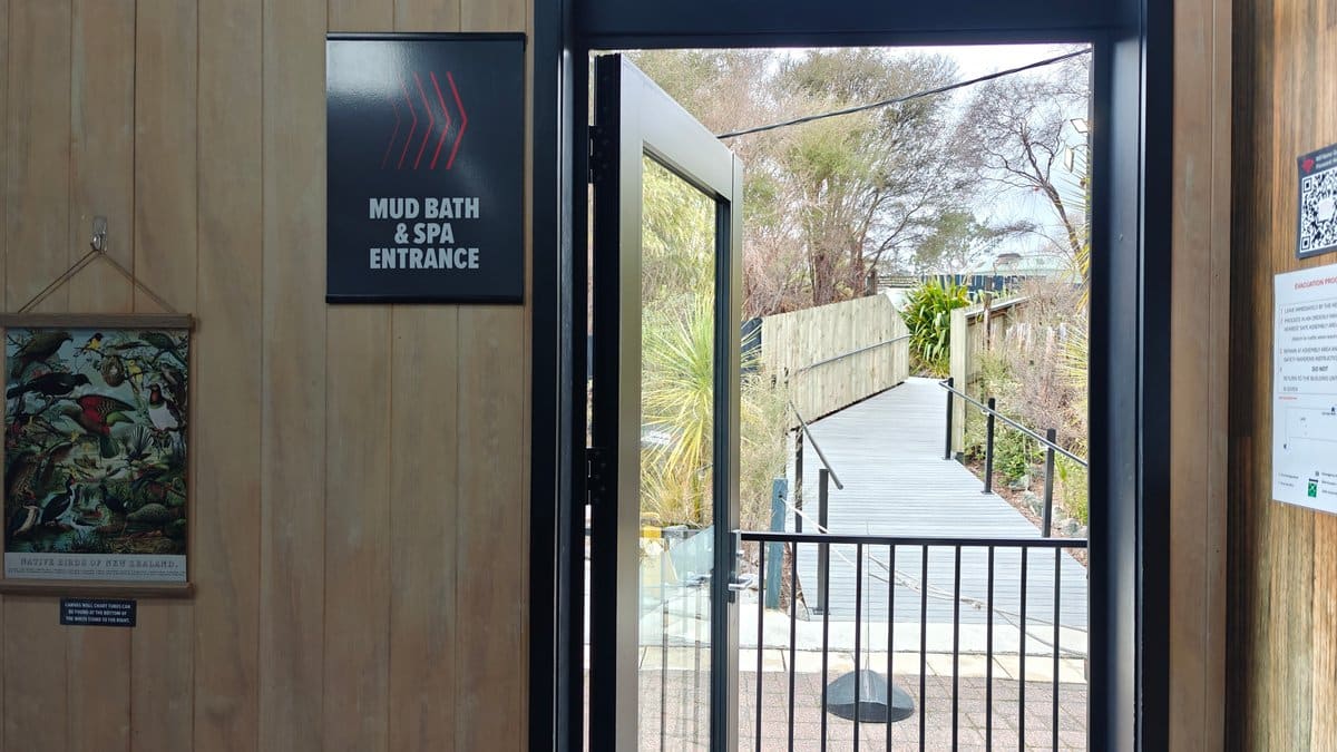 A MUD BATH & SPA ENTRANCE sign beside