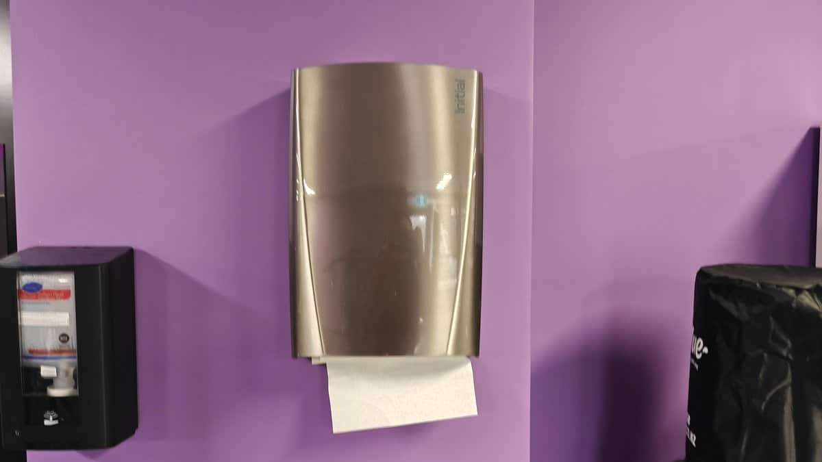 A paper towel dispenser mounted on the wall.