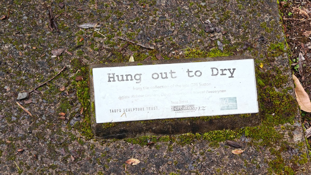 A plaque set into stone headed Hung out