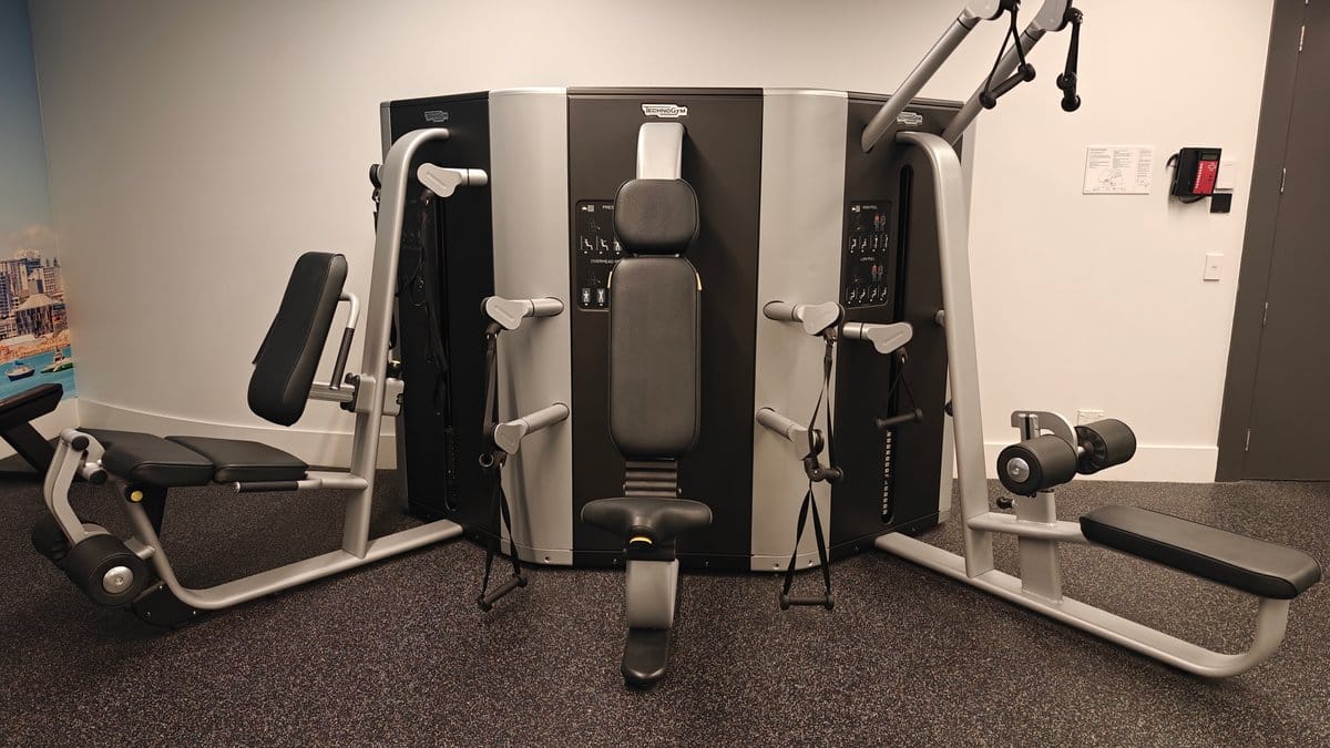 A plate-loaded resistance machine on the gym floor.