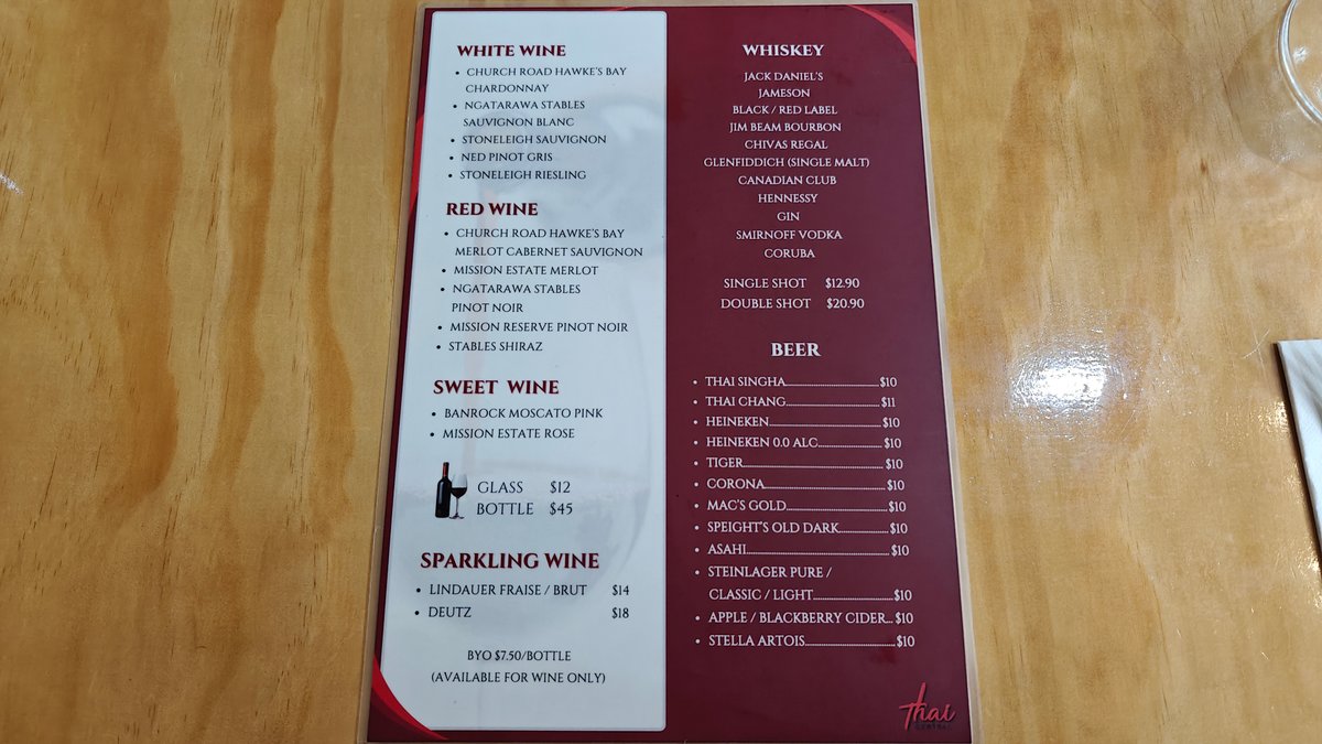A printed menu card propped on the table.
