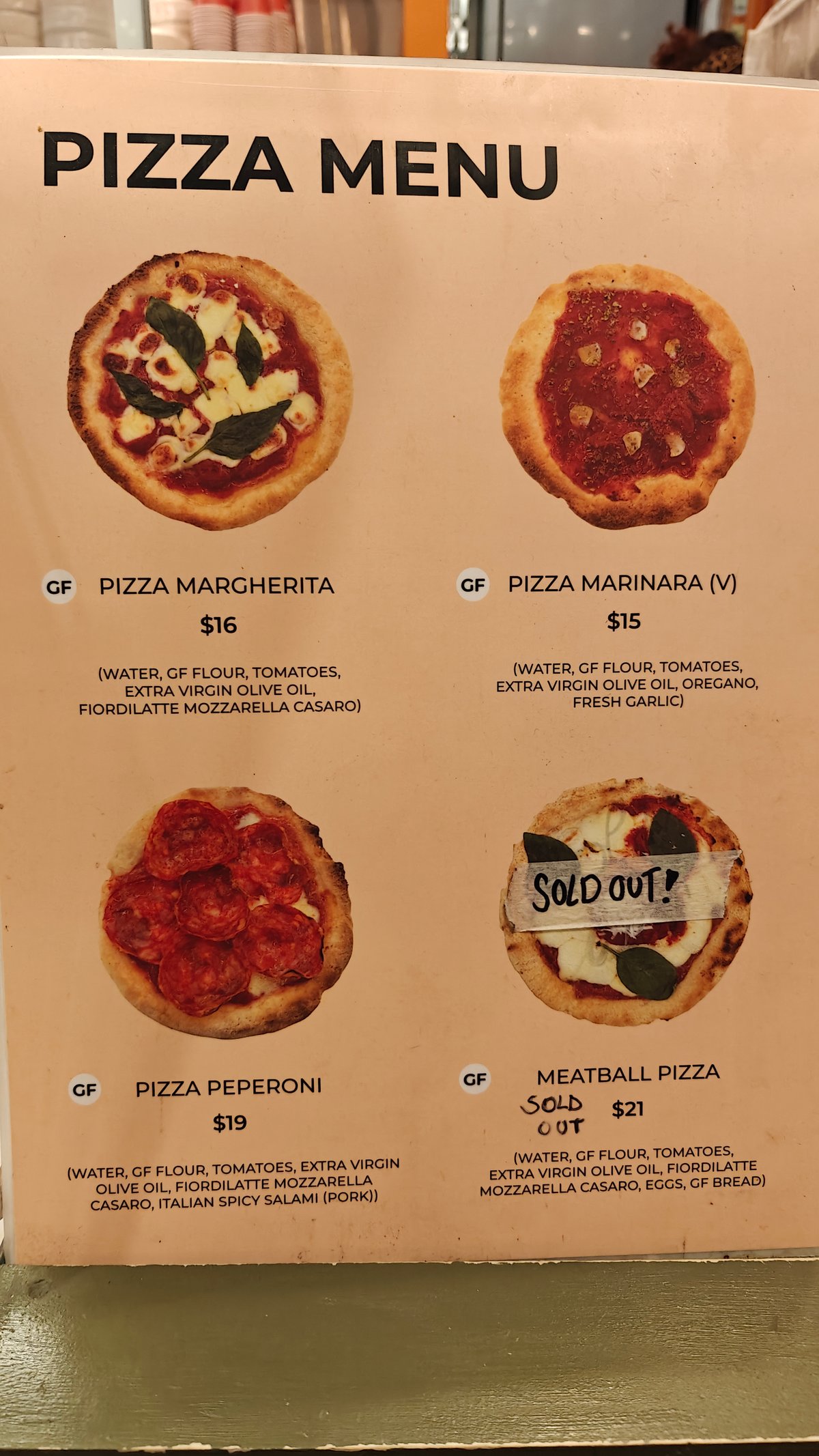 A printed pizza menu — Pizza Margherita $16,