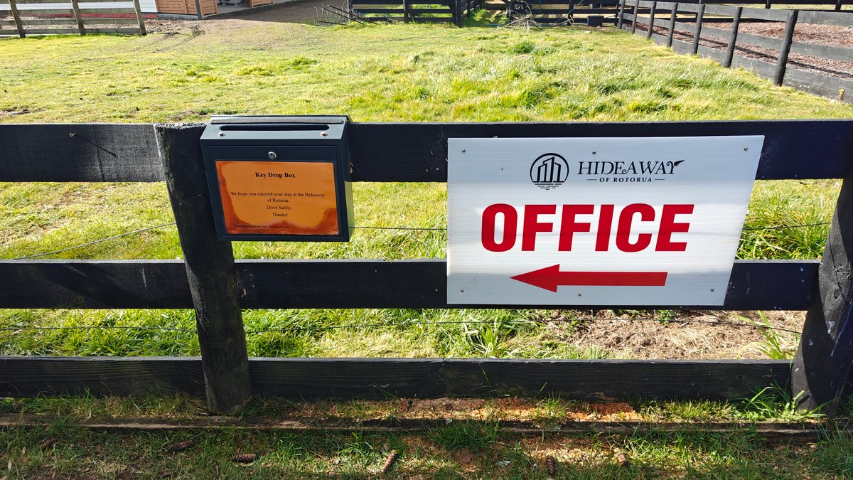 A red and white OFFICE sign with an