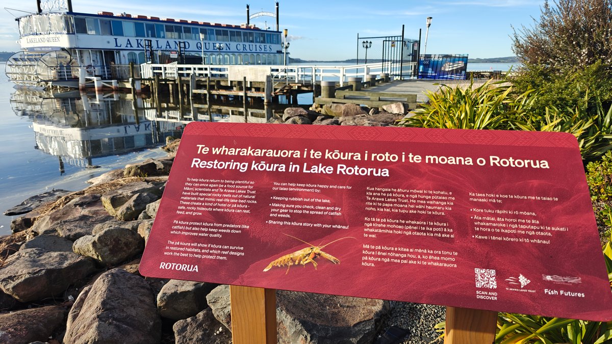 A red interpretive board headed Te wharakarauora i