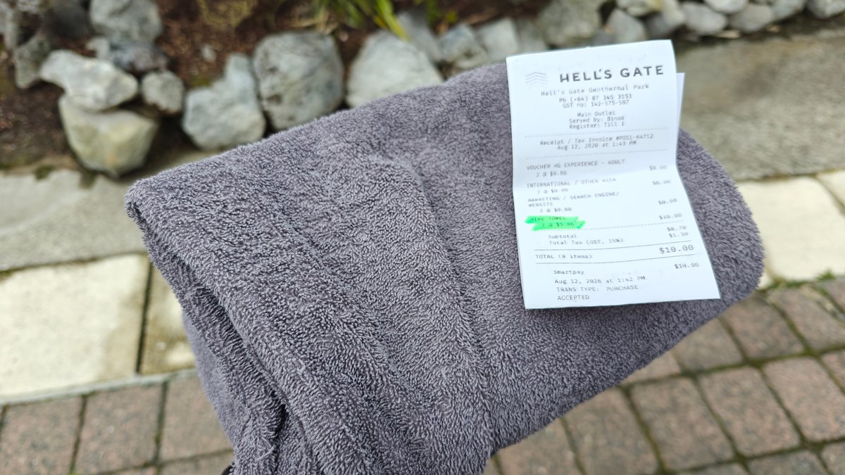A rolled towel with the Hell's Gate receipt