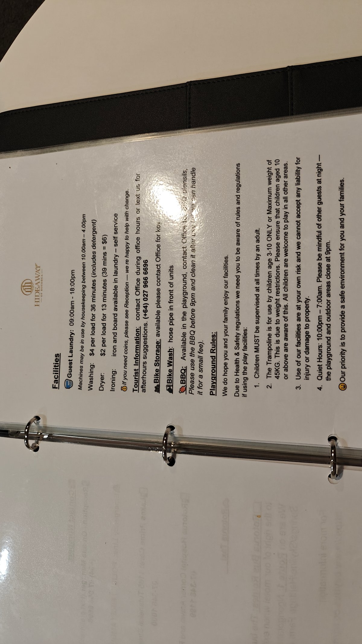 A second laminated notice on the wall beside