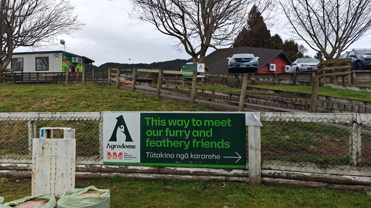 A sign reading This way to meet our