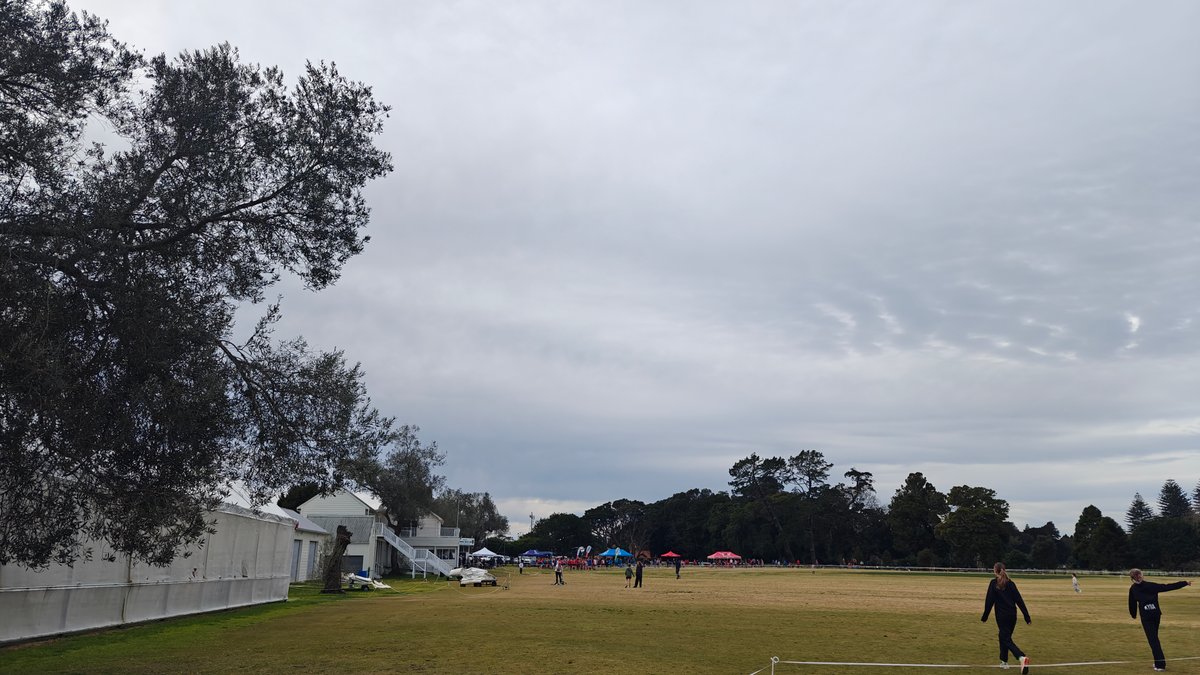A sports field with a marquee pitched and
