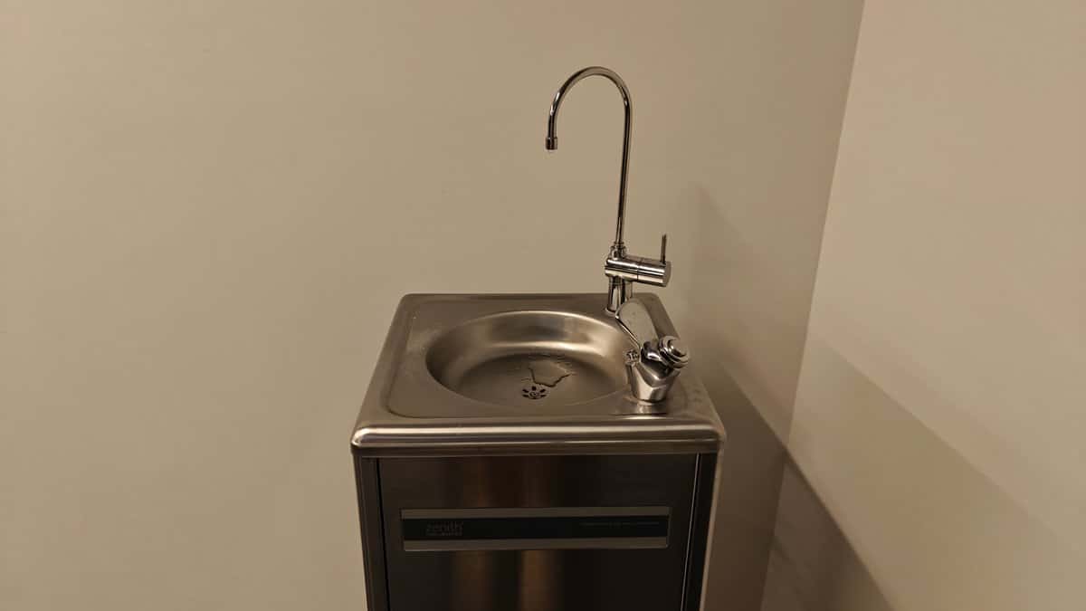 A stainless steel drinking fountain and basin set