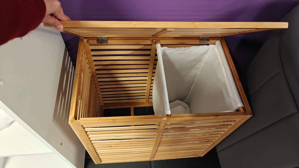 A timber laundry basket for used towels.