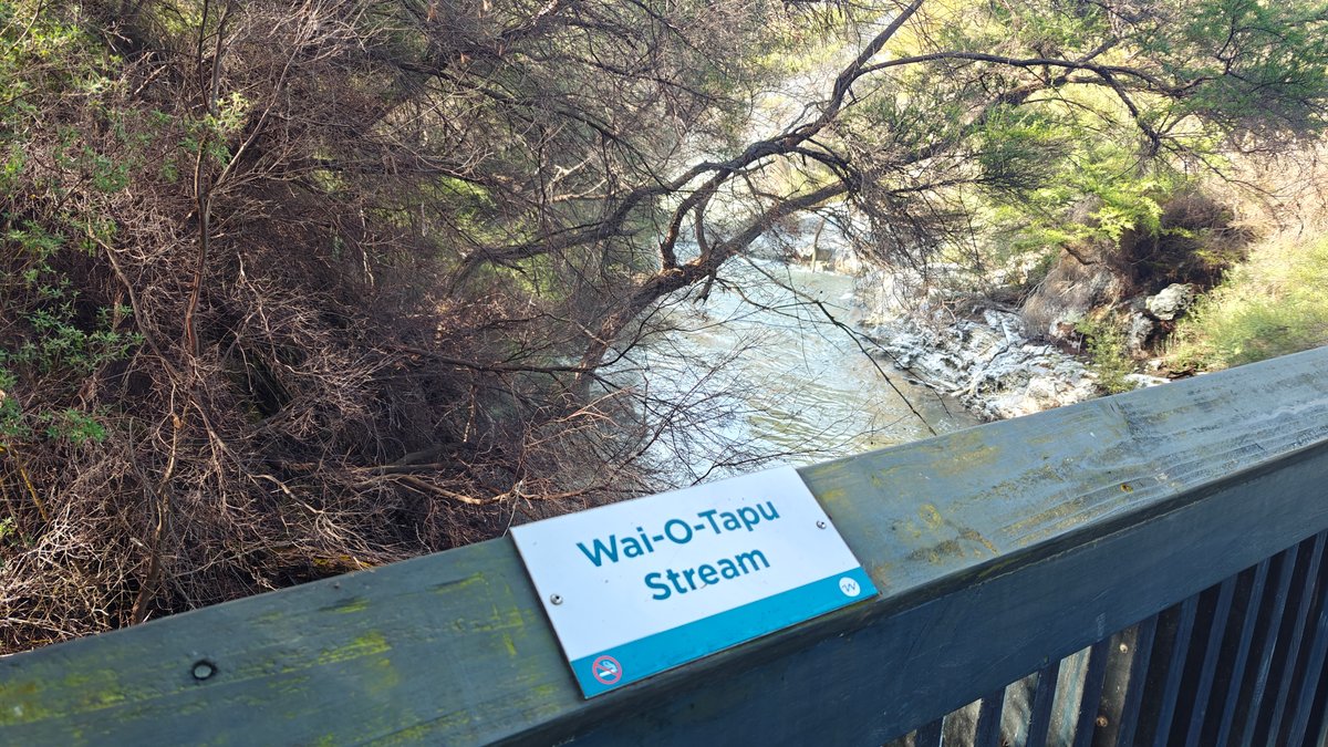 A Wai-O-Tapu Stream sign fixed to the bridge