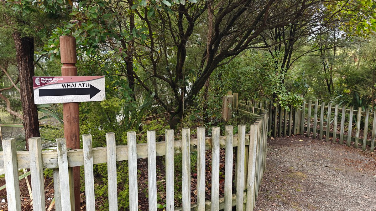 A WAIRAKEI direction arrow on a post beside