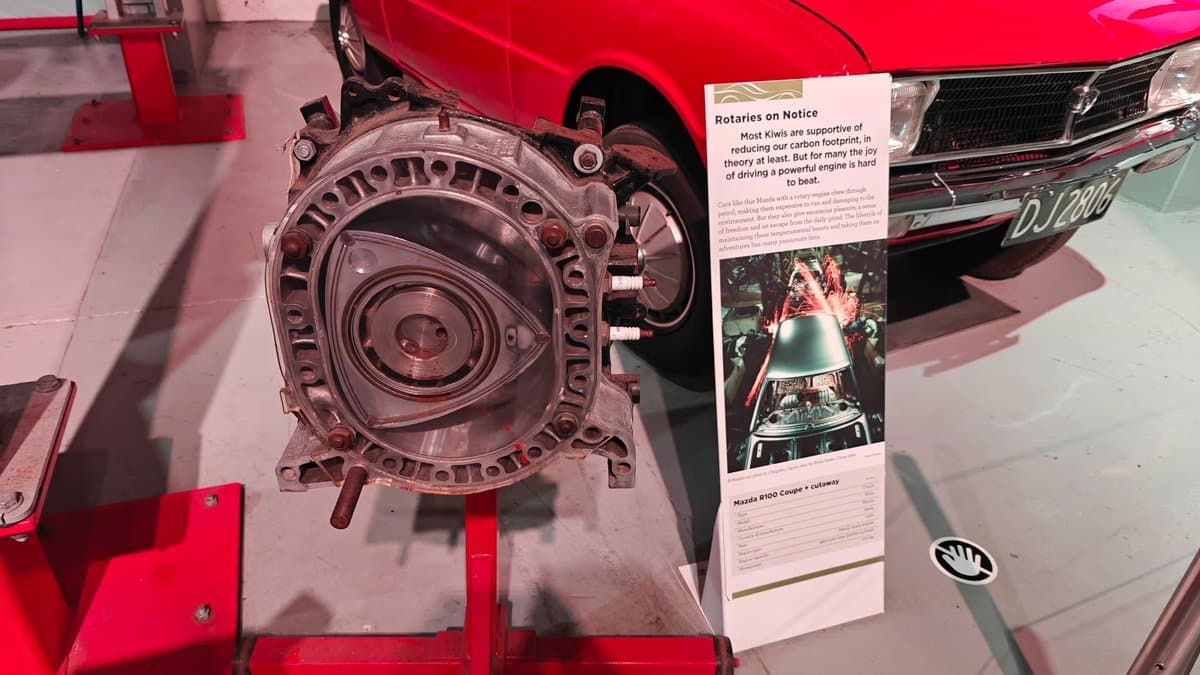 A Wankel rotary engine mounted on a red