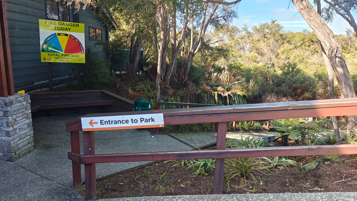 An Entrance to Park sign on the fence