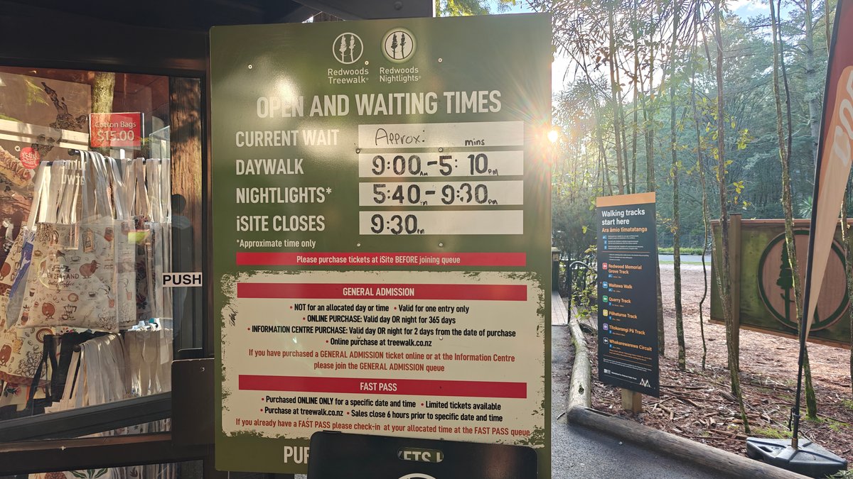 An OPEN AND WAITING TIMES board giving the