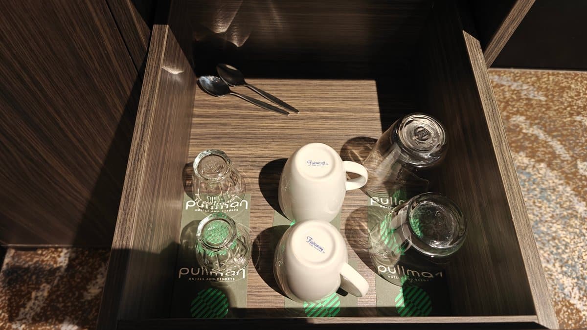 An open drawer with Pullman cups and a