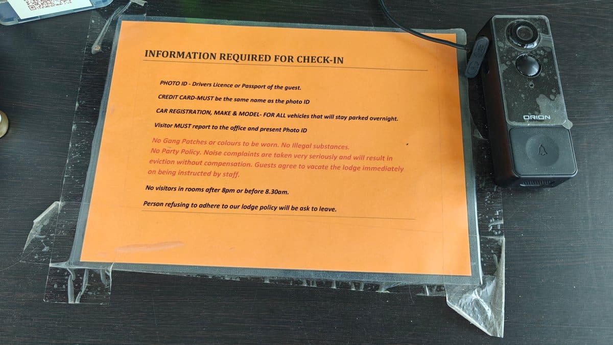 An orange notice headed INFORMATION REQUIRED FOR CHECK-IN