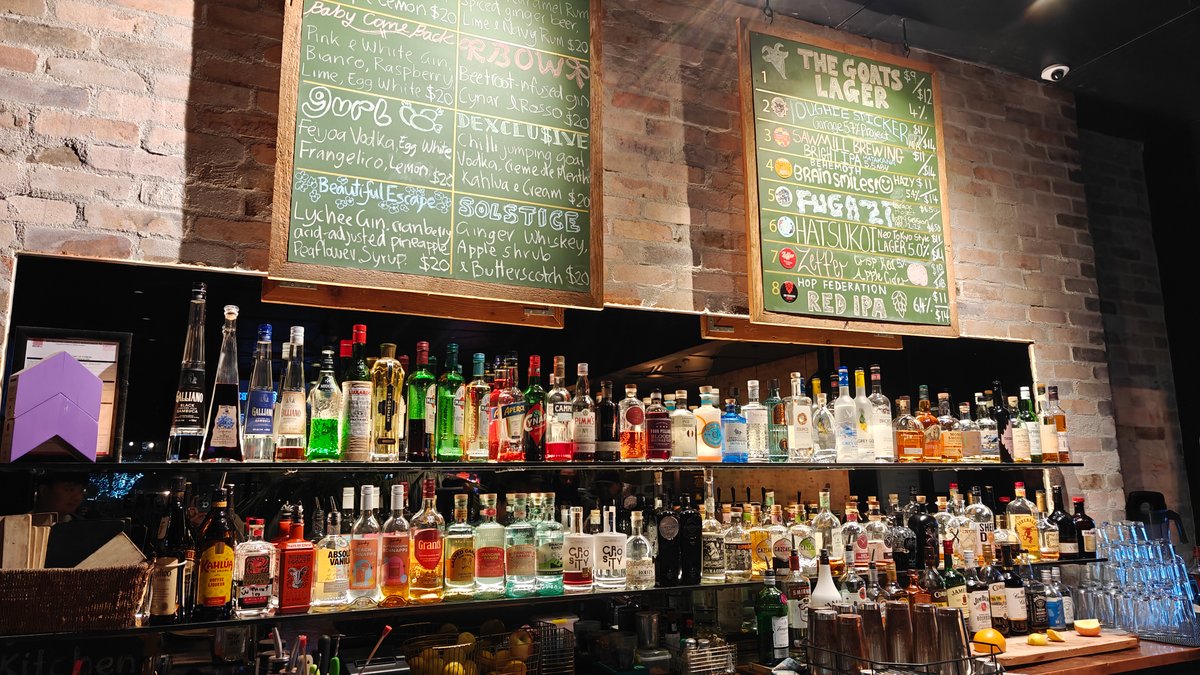 Bar shelves under chalkboard menus