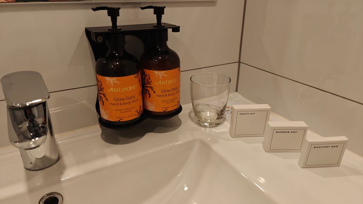 Basin with amber amenity bottles