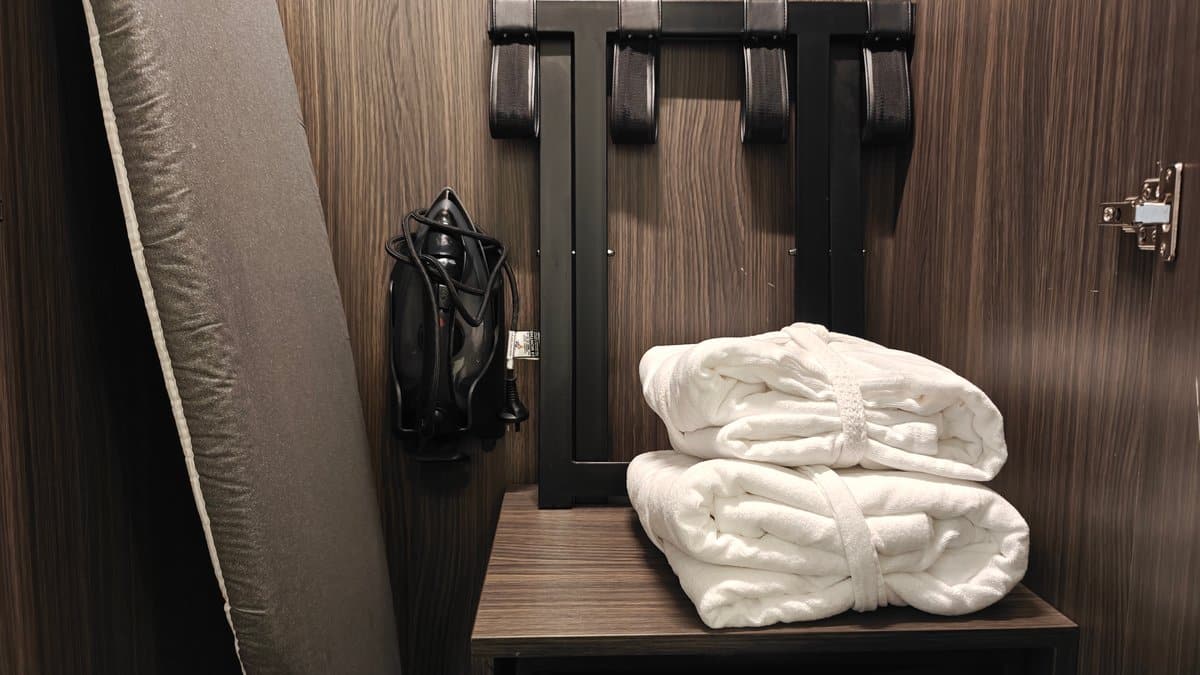 Bathrobe and rolled towels stacked