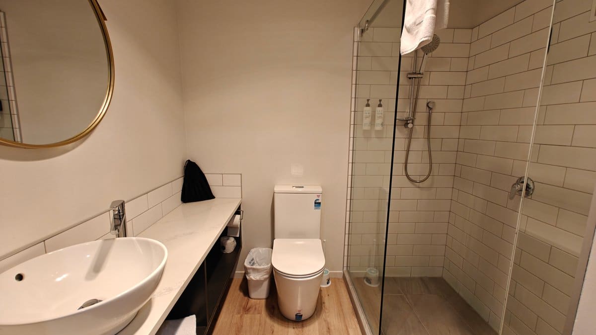 Bathroom with shower and vanity