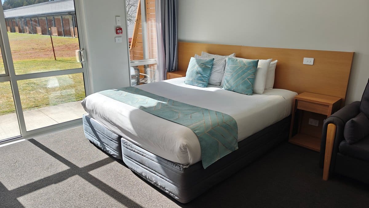 Bed against timber headboard
