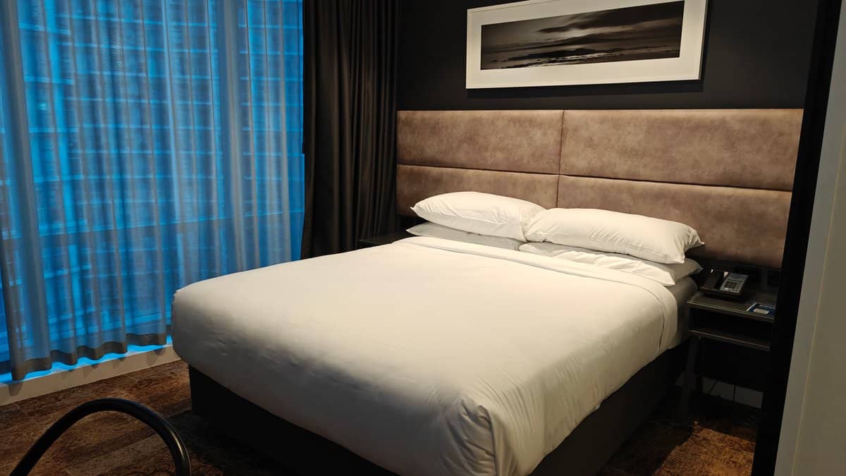 Bed with artwork above headboard