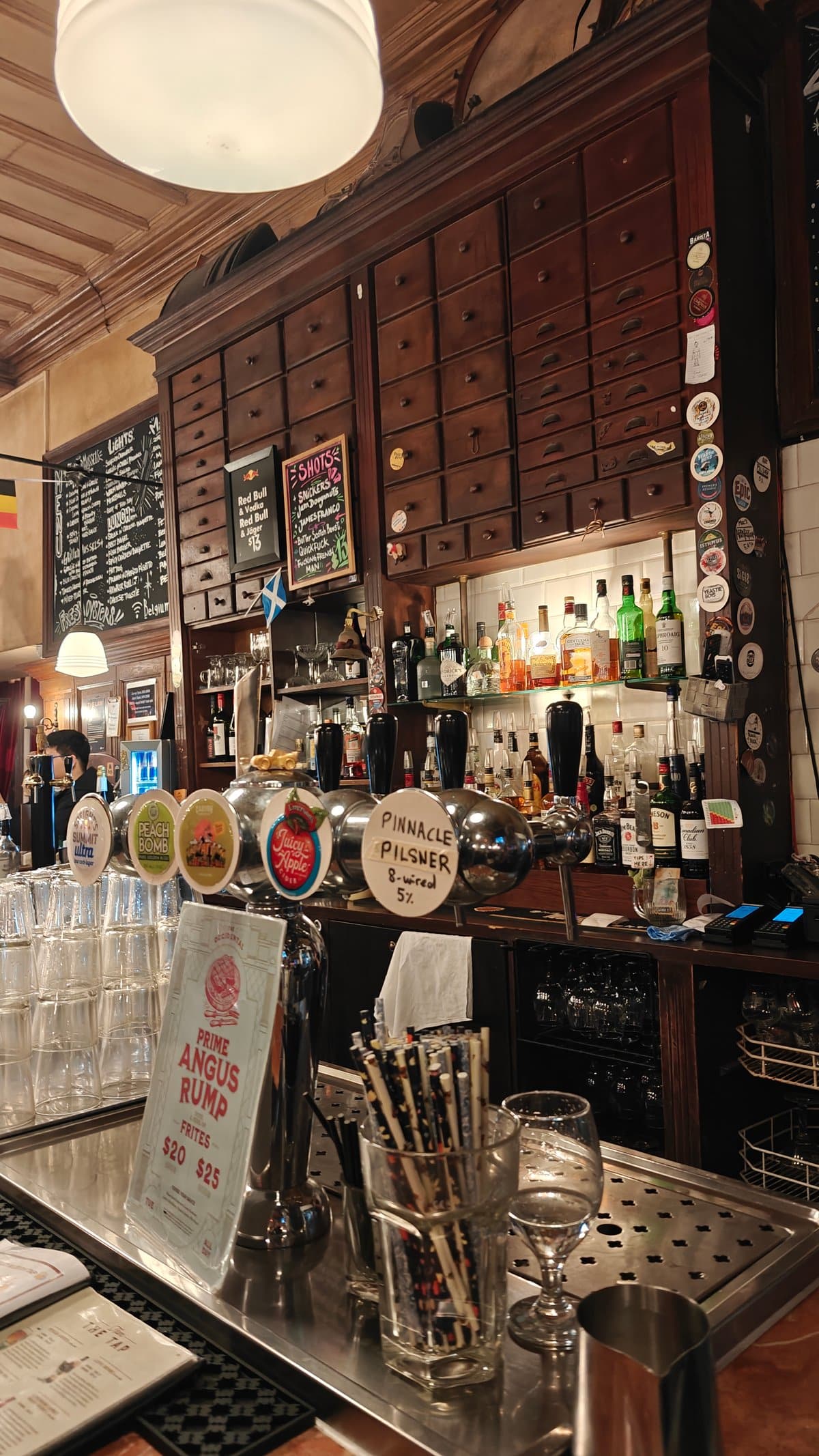 Belgian beer taps along the bar