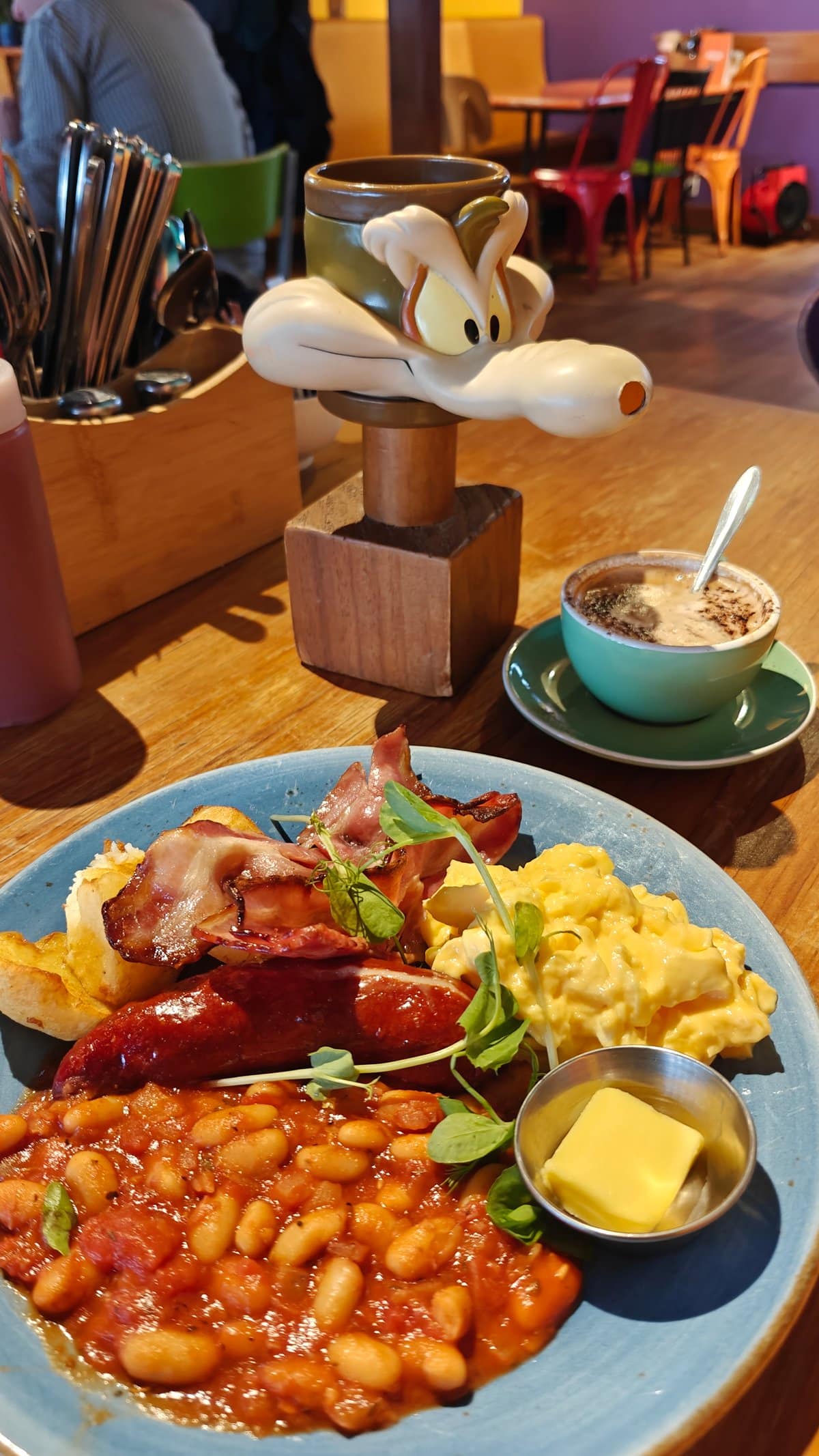 Breakfast plate beside the coffee